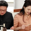 Ông Kim Jong-un và phu nhân “hứng thú” với chiếc búa nhỏ trên bàn tiệc