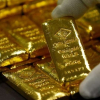 Giá vàng thế giới và chứng khoán Mỹ đồng loạt giảm