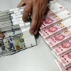 Ngân hàng Trung Quốc khử trùng tiền mặt