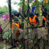 Cảnh báo lũ quét và sạt lở đất ở Trung Bộ, ngập lụt tại Nam Bộ