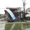 Đà Nẵng: Đường phố ngổn ngang, bờ biển tan hoang sau bão số 9